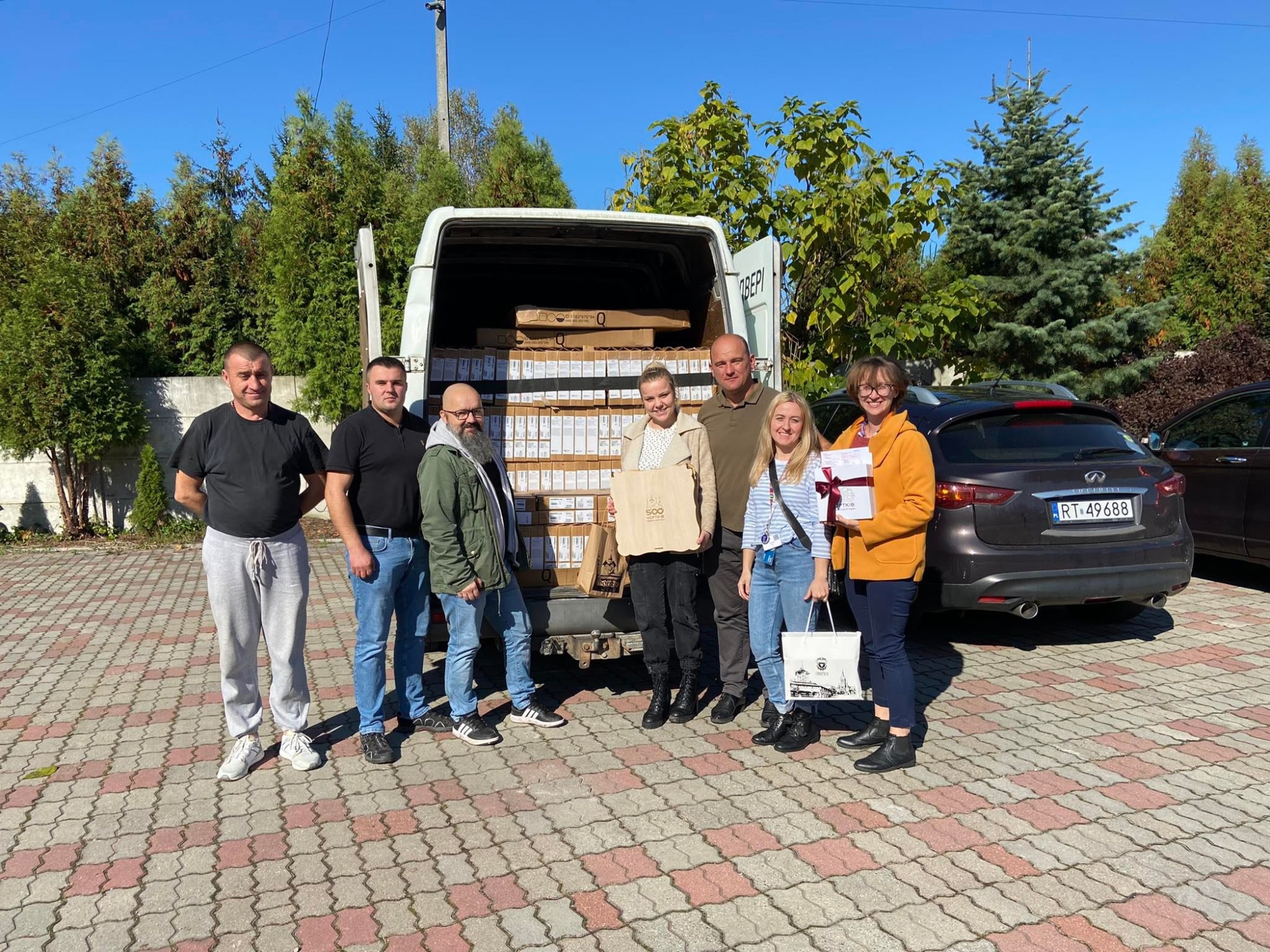 Fundacja Q staff and volunteers load trucks with laptops for delivery to students and teachers in Ukraine.