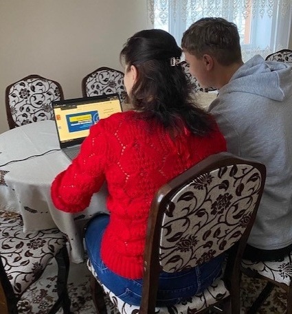 Markian, 16, and his mother, Tetiana, using their donated laptop in their town Gródka Jagiellońskiego, Western Ukraine